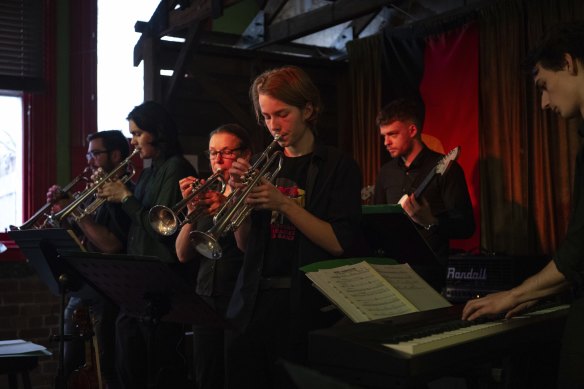 Bass player Damien Reynolds (second from right) performs at The Retreat.