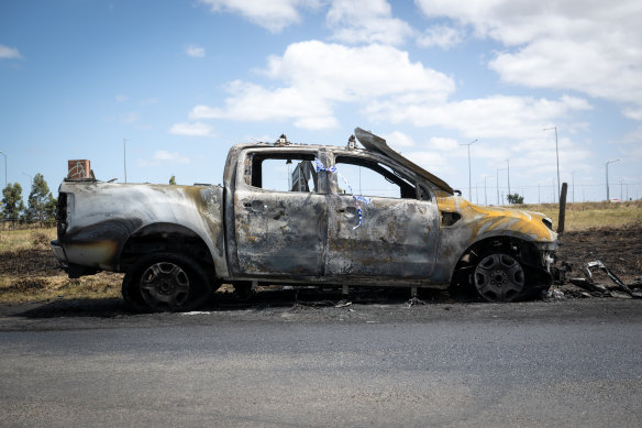 The burnt-out car believed to have been used as a second getaway vehicle.