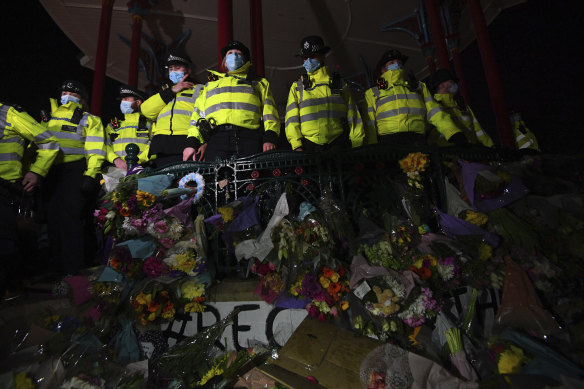 Police stand on the bandstand on Clapham Common as people gathered despite the Reclaim These Streets vigil for Sarah Everard being officially cancelled, in London.