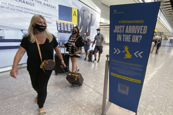 Passengers arrive at Heathrow Airport from Greece. The British government has added several Greek islands to the coronavirus quarantine list.