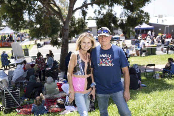 Beata “BB” Stednik and her husband William at their community Christmas barbecue at the Hampton Park Junior Football Club oval.