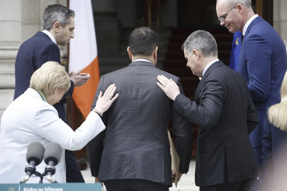 Irish Prime Minister Leo Varadkar, centre, leaves after announcing his resignation in Dublin, Ireland, on Wednesday.