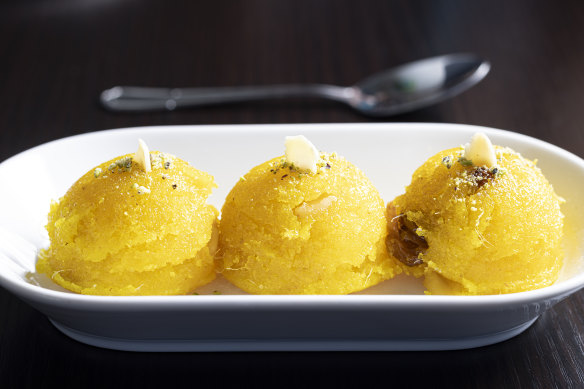 Pineapple kesari, a semolina pudding studded with cashews and raisins and glossed up with ghee.
