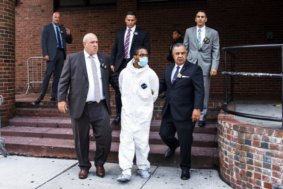 Tyrese Haspil, 21, is escorted out of the 7th precinct by NYPD detectives on July 17, 2020.