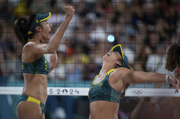 Mariafe Artacho Del Solar and Taliqua Clancy celebrate victory over Switzerland in their beach volleyball quarter-final.