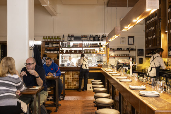 Melburnians took some convincing to sit at the restaurant’s tapas bar (right).