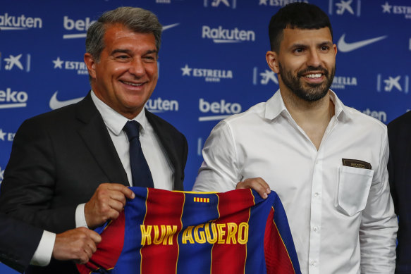 Barcelona president Joan Laporta and new signing Sergio Aguero.