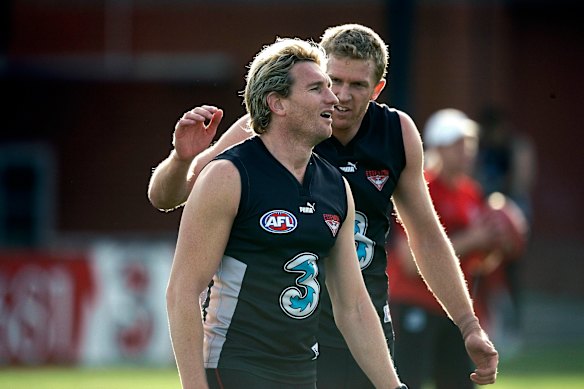 James Hird with Fletcher at Essendon training in 2007.