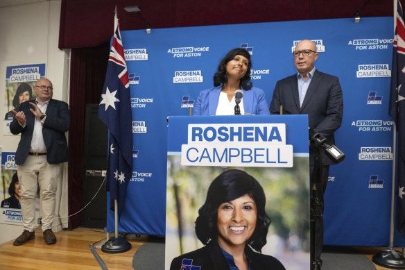 Federal Opposition Leader Peter Dutton with Roshena Campbell ahead of her concession speech in the Aston byelection.