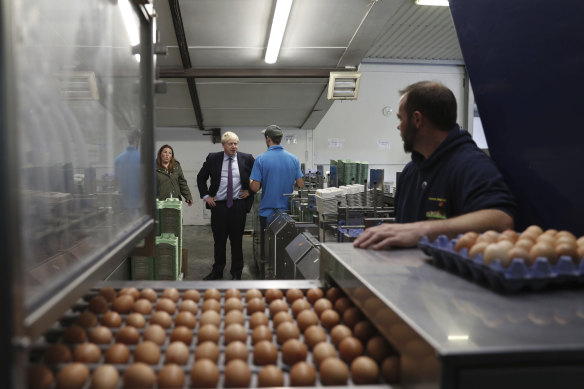 British PM Boris Johnson inspects the egg operation during his visit to rally support for his farming plans post-Brexit.