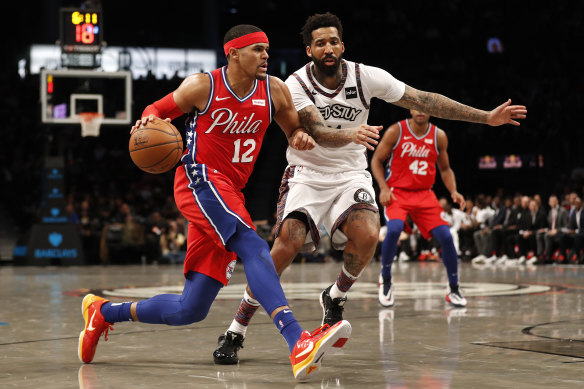 Tobias Harris drives against Wilson Chandler in the 76ers' loss to the Nets.
