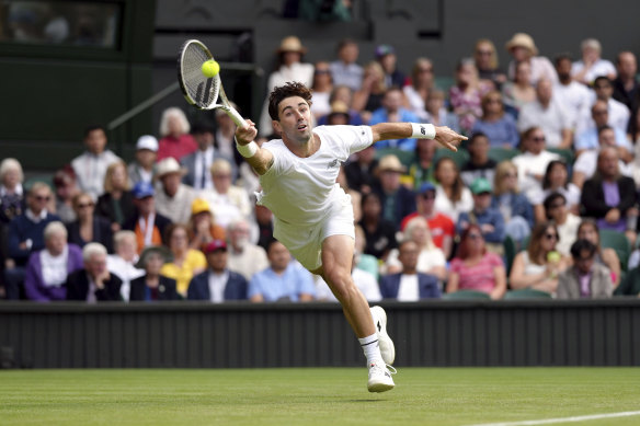 Jordan Thompson plays a return to Novak Djokovic during the men’s singles match on day three of the Wimbledon tennis championships.