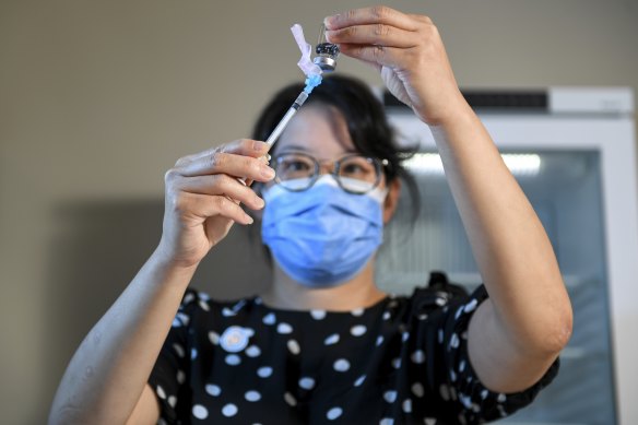 Dr Erica Tong practises preparing the coronavirus vaccine. Her staff at The Alfred have been “simulating everything” ahead of the rollout.