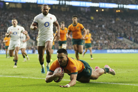 Tom Wright scores against England at Twickenham.