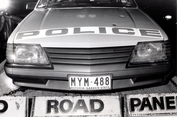 A police car showing bullet holes after officers caught up with Mad Max.