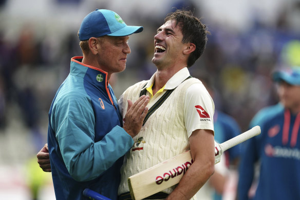 Australia captain Pat Cummins celebrates with coach Andrew McDonald after the first Ashes test.