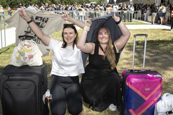 Friends Sophie Lobwein (left) and Sally Coghlan, from Brisbane, went to the Taylor Swift merchandise tent at Melbourne Airport early on Thursday morning. They will be at Saturday’s concert at the MCG.