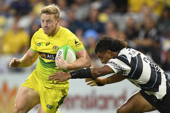Lachlan Miller taking on Fiji in the Oceania Sevens tournament in June.