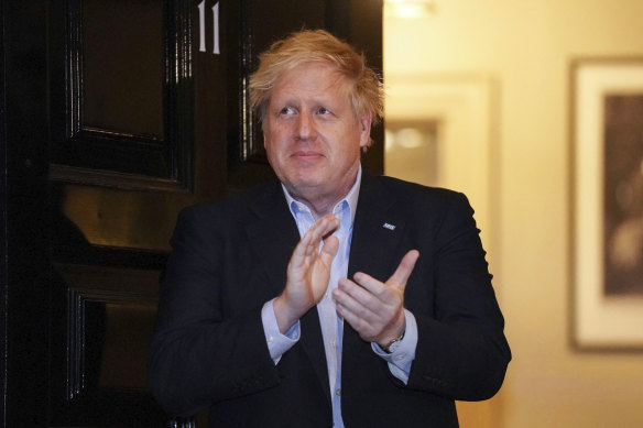 Prime Minister Boris Johnson claps outside 11 Downing Street to salute local heroes during last week's nationwide Clap for Carers NHS initiative. Johnson has been living at No 11 in isolation after being diagnosed with COVID-19.