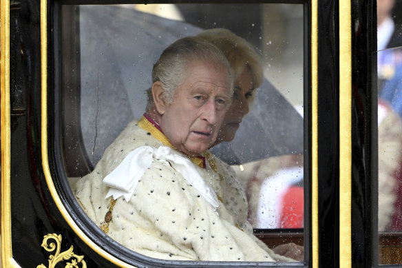 A lip reader says Charles grumbled to Camilla after his carriage arrived early.