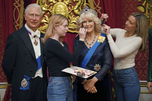 Artists Sophie Greenaway, second left and Claire Parkes add the finishing touches to a new Camilla, Queen Consort wax figure at Madame Tussauds in London,  ahead of the coronation of King Charles III on May 6.
