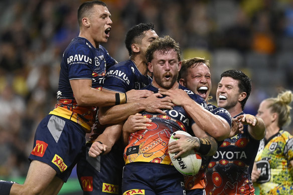 The Cowboys celebrate Sam McIntyre’s try.