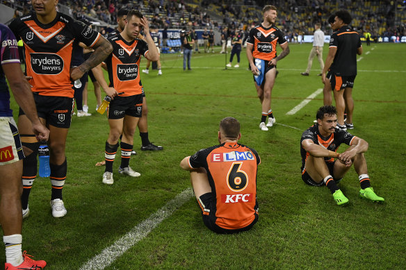 Shattered Tigers players digest the outcome after full-time on Sunday.