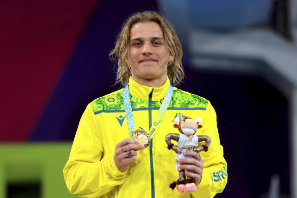 Cassiel Emmanuel Rousseau celebrates with his gold medal.