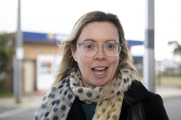 Miranda Bordignon waits for bus at Newport after road and rail closures caused disruption for commuters.