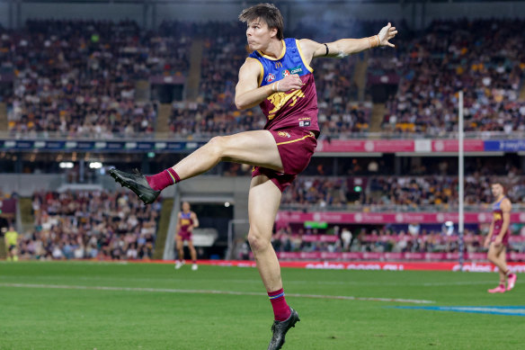 Eric Hipwood of the Lions kicks the ball.