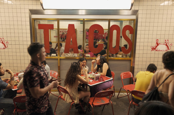 Diners at a taqueria in the Mexico City neighbourhood of Roma Norte.