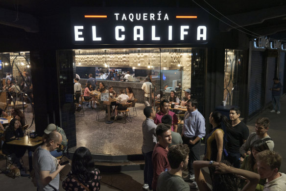 Visitors wait to be seated at El Califa, a chain of taquerias that has branches in affluent Mexico City neighbourhoods.