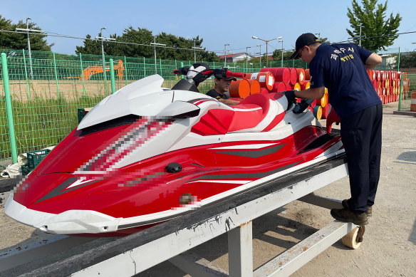 South Korean personnel inspect a jet-ski after the coast guard arrested a Chinese man who “attempted to smuggle into” the western port city of Incheon.