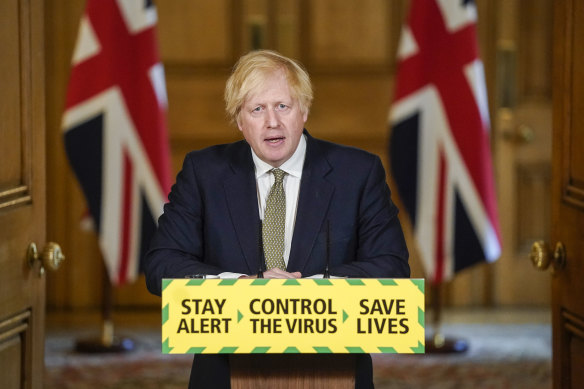 British Prime Minister Boris Johnson speaks during a media briefing on coronavirus. His own staff did not observe lockdown rules.