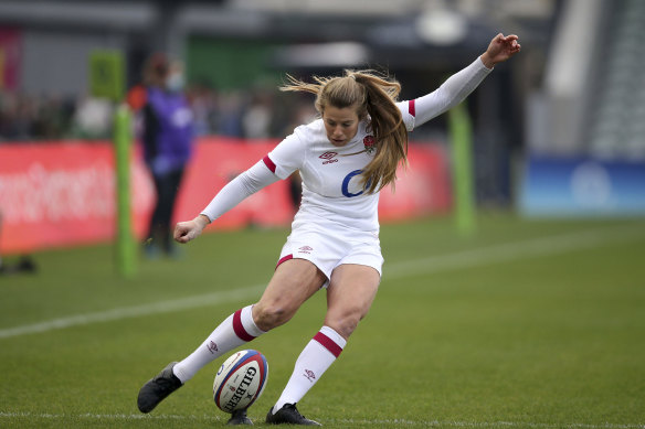 England’s Zoe Harrison takes a kick at goal. 