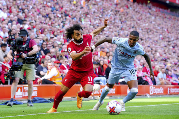Liverpool’s Mohamed Salah, left and Aston Villa’s Ashley Young battle for the ball.