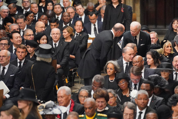 US President Joe Biden takes his seat with wife Jill Biden and other heads of state and dignitaries, including French President Emmanuel Macron (left) at Westminster Abbey,