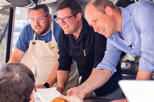 Prince William serving up the burgers.