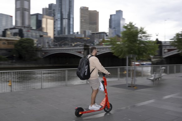 An e-scooter rider on Southbank Promenade in Melbourne.