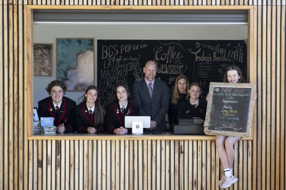 Balcombe Grammar principal Ross Patterson with students (left to right) Massimo, Emmerson, Kobi, Annali, Sophie and Indigo in their marketplace cafe.