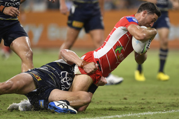 Ben Hunt battles his way to the line for a try.