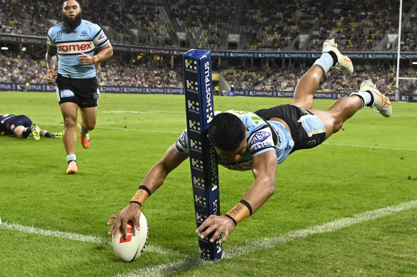 Ronaldo Mulitalo scores a spectacular try in the corner for the Sharks.