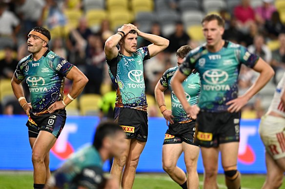 Cowboys players react after conceding 82 points to the Roosters. 