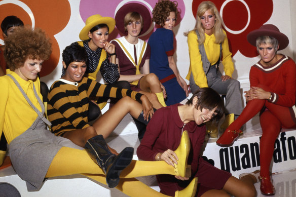 British fashion designer Mary Quant, foreground centre, poses with models wearing her creations, in London, on Aug. 1, 1967. Quant, the designer whose fashions epitomised the Swinging 60s, has died at the age of 93. Quant’s family said she died “peacefully at home” in Surrey, southern England, on Thursday, April 13, 2023.