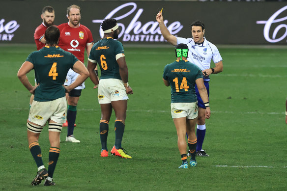 Cheslin Kolbe of South Africa is shown the yellow card.