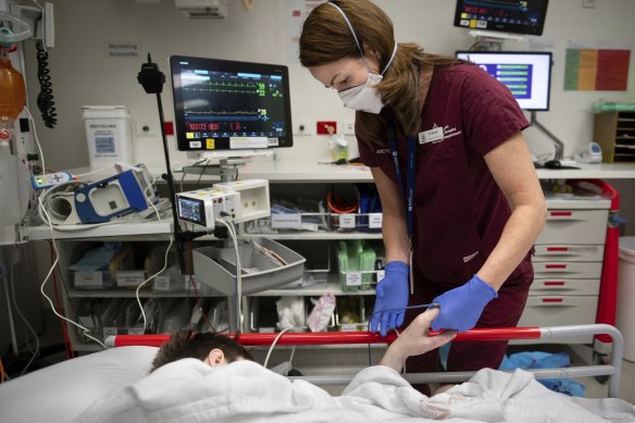 Dr Emma West tends to a patient in the emergency department this month.