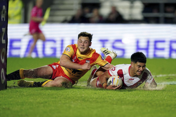 Isaiya Katoa scores a try for Tonga in St Helens.