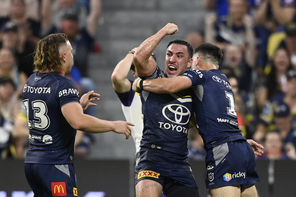 Cowboys linebacker Reece Robson celebrates the try.