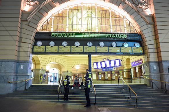 PSOs outside Flinders Street Station during COVID.