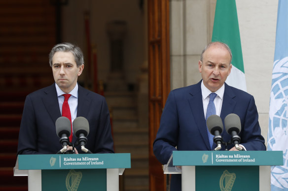 Ireland’s Prime Minister Simon Harris, left, and Tanaiste Micheal Martin speak to the media in Dublin on Wednesday.